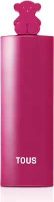 A pink perfume bottle with a teddy bear-shaped cap and the brand name "TOUS" printed on it.