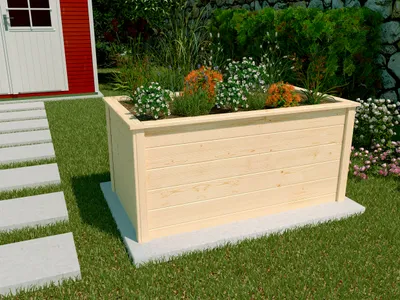 A wooden raised garden bed filled with plants and flowers, situated on a lawn next to a red shed and a path of stepping stones.
