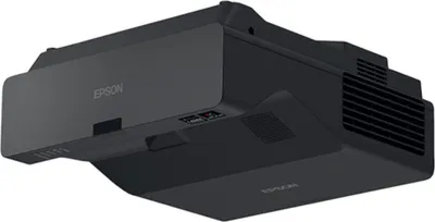 A black Epson projector is shown from a diagonal, slightly elevated angle against a white background.