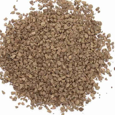 A pile of granular fertilizer on a white background.