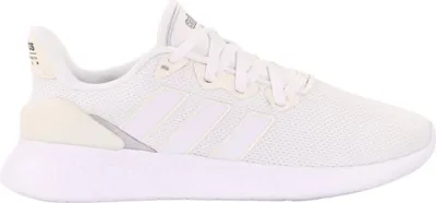 A side view of a white Adidas sneaker against a white background.