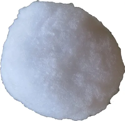 A close-up, top-down view of a single white snowball.