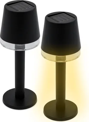 Two black solar table lamps with solar panels on top, one emitting a yellow light.
