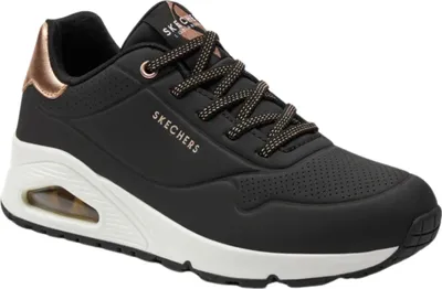 A black Skechers Uno Shimmer women's sneaker with rose gold accents.