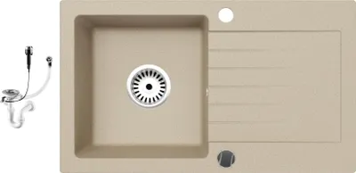 A top-down view of a beige granite kitchen sink with a drainer and a separate siphon set.