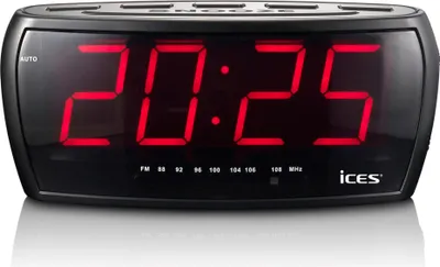 A digital alarm clock with a red LED display showing the time.