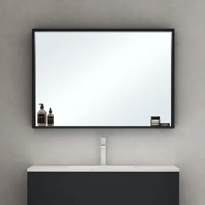 A bathroom vanity with a mirror above it.