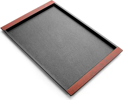 A rectangular tray with a dark gray textured surface and a reddish-brown border.