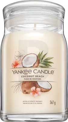 A Yankee Candle Coconut Beach scented candle in a glass jar with a lid.