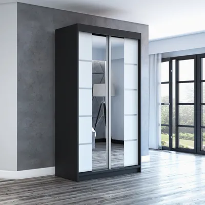 A wardrobe with sliding doors in a room.