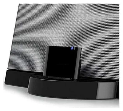 A close-up view of a black and gray speaker dock with a mesh front.