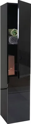 A tall, narrow black cabinet with one door open, revealing shelves with folded towels and a decorative item.