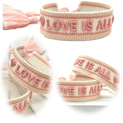 Produktbild von LS-LebenStil Canvas Statement Armband Love is All Rosy Peach besticktes Stoffarmband gewebt textiles Quasten Spruch Boho Geschenk Freundschaftsarmband