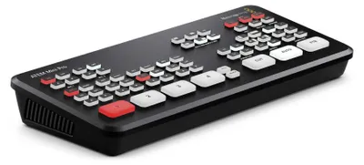 A black Blackmagic Design ATEM Mini Pro video switcher with many buttons.