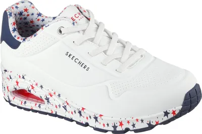 A single white sneaker with red and blue star pattern on the sole and inner lining.