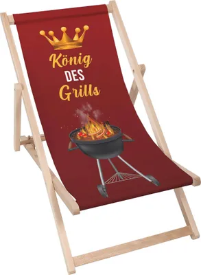 A red deck chair with a graphic design featuring a crown, text, and a barbecue grill.