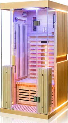 An infrared sauna cabin with wooden interior and glass doors, illuminated by colored lights.