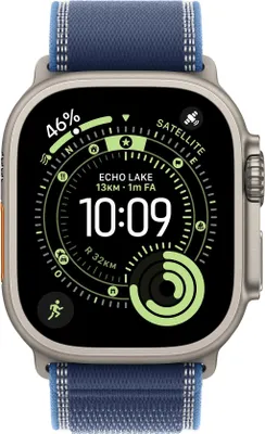 A close-up of an Apple Watch Ultra with a digital watch face displaying time, location, and activity data.