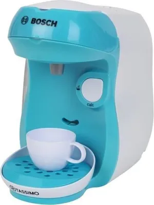 A toy Bosch Tassimo coffee maker with a cup.
