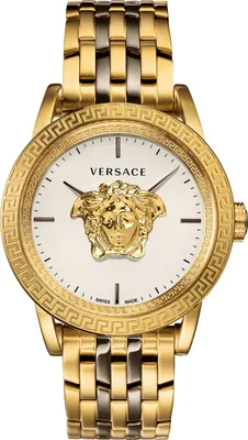 A close-up studio shot of a gold Versace watch with a white face.