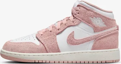 A side view of a pink and white Nike Jordan 1 Mid sneaker.