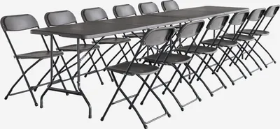 A set of folding tables and chairs arranged in a long line.