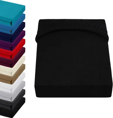 A stack of colorful fitted sheets is shown on the left, and a single black fitted sheet is displayed on the right.