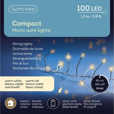 A close-up of a string of micro wire LED lights with packaging information in the background.