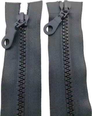 Two grey zippers are displayed side-by-side against a white background. The zippers are closed and show their plastic teeth and sliders with pull tabs.