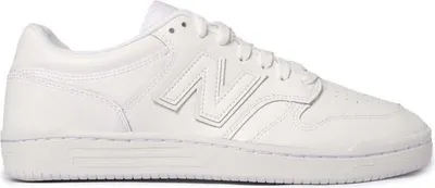 A white New Balance sneaker is shown from the side against a white background.
