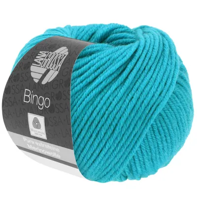 A ball of turquoise yarn with a label.