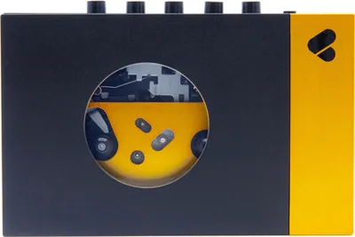 A close-up view of a portable cassette player with a circular window revealing internal components.