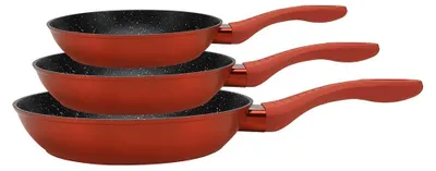 A stack of three red frying pans with black interiors and speckled detailing, each with a red handle, are shown against a white background.