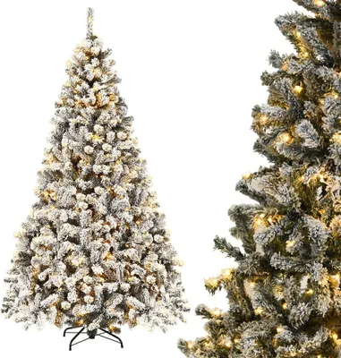 A flocked artificial Christmas tree with warm white LED lights and a metal stand.