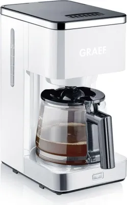 A white and silver coffee maker with a glass carafe filled with coffee, set against a white background.