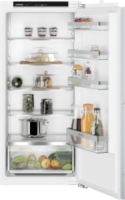 An open refrigerator filled with food and drinks.