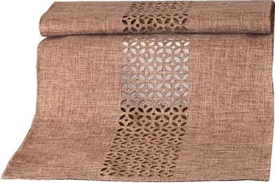 A folded table runner with a cut-out pattern.