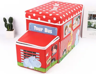 A red toy bus storage box with white polka dots and cartoon animal and child illustrations.