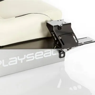 A close-up view of a Playseat gearshift holder attached to a racing seat.