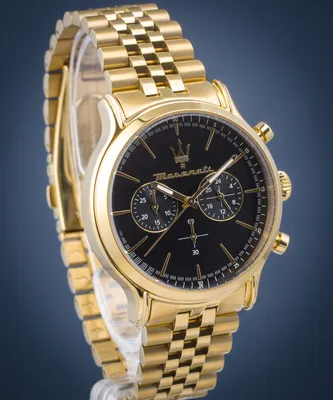 A close-up studio shot of a gold Maserati watch with a black dial.