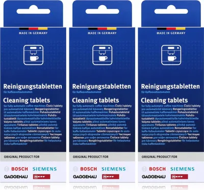 Three identical packages of cleaning tablets for coffee machines.