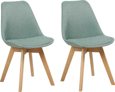 Two mint green upholstered chairs with light wood legs are shown against a white background.