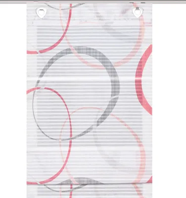 A close-up of a window blind with a circular pattern.