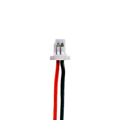 A close-up of a battery connector with two wires.