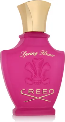 A studio shot of a pink Creed Spring Flower Eau de Parfum bottle with a gold cap.