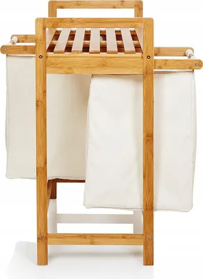 A bamboo laundry basket with two fabric bags hanging from it, shown against a white background.