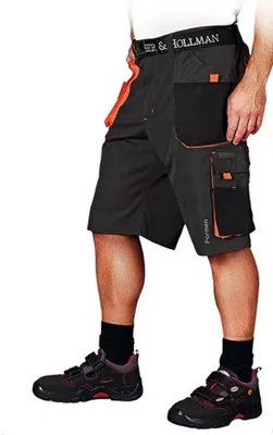 A person wearing work shorts and shoes.