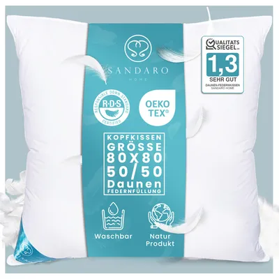 A white pillow with a teal label and feathers.