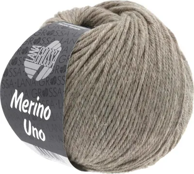 A ball of taupe colored yarn with a label.