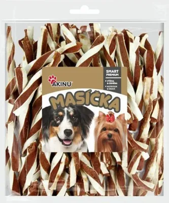 A clear plastic bag filled with dog treats, with a label featuring two dogs and product information.